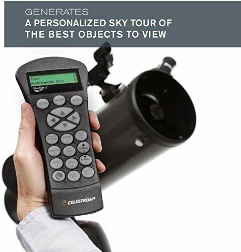 Hand holding Celestron telescope controller with telescope in background.