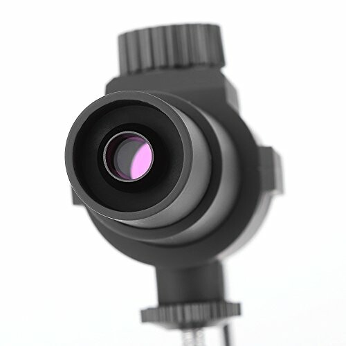 Close-up of a telescope eyepiece with purple lens